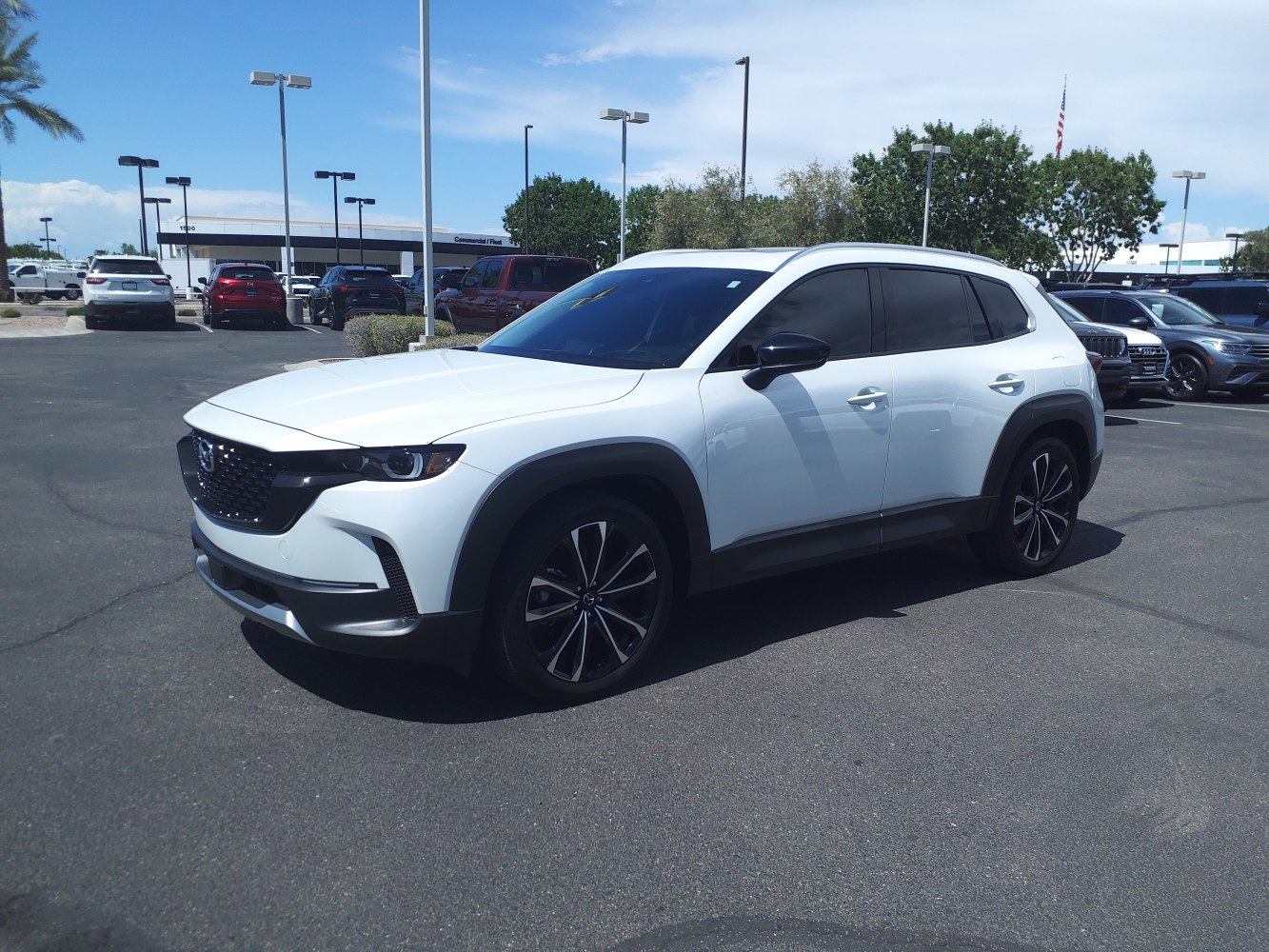 White mid-size SUV with modern aerodynamic design and black accents