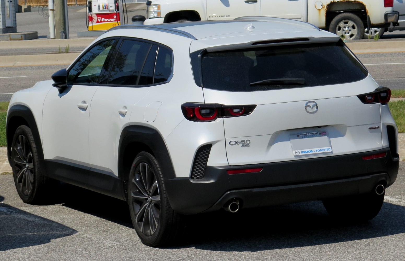 Rear side view with sleek taillights and black trim accents