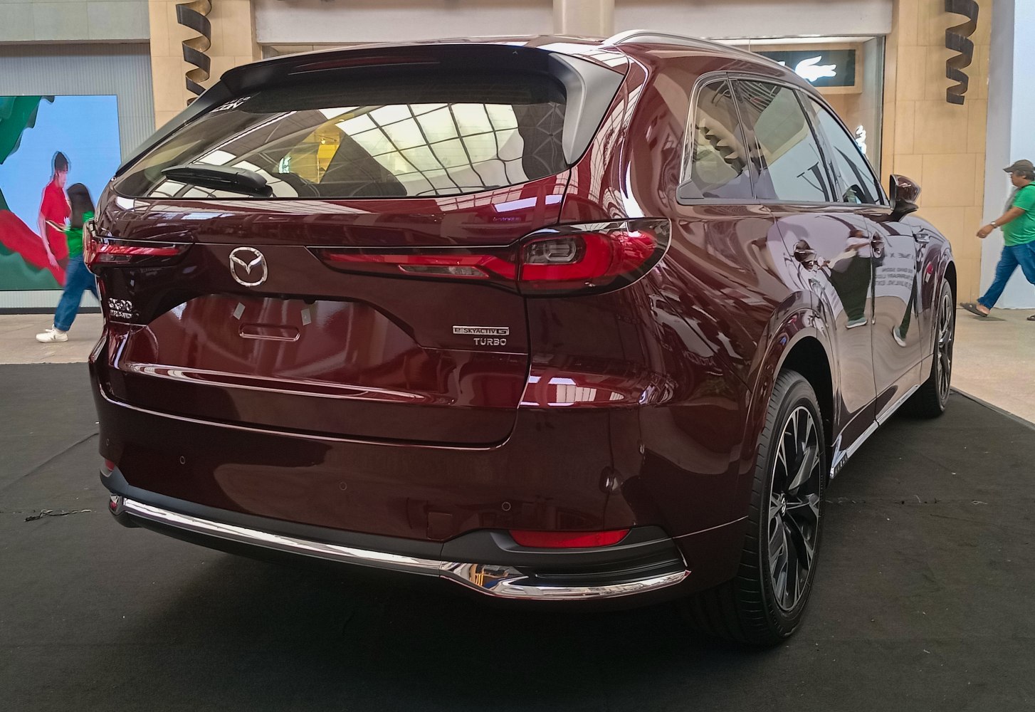 Rear view of SUV with Skyactiv-G Turbo badge and sleek tail lights