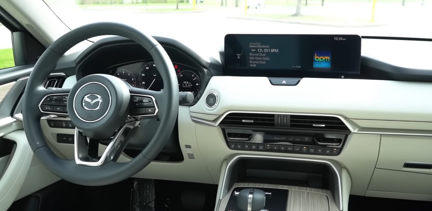 Interior dashboard with digital infotainment and steering wheel controls