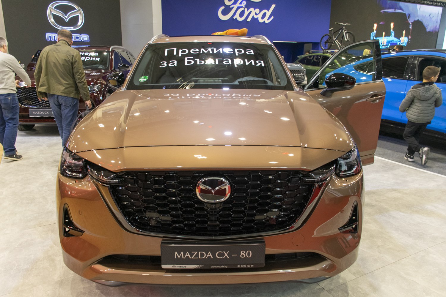Front view with black mesh grille and LED headlights