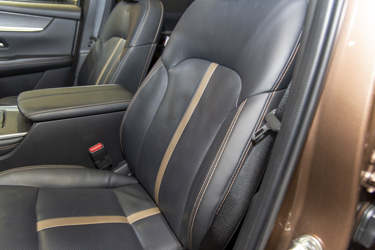 Leather front seats with perforation, contrast stitching, and center accent strip