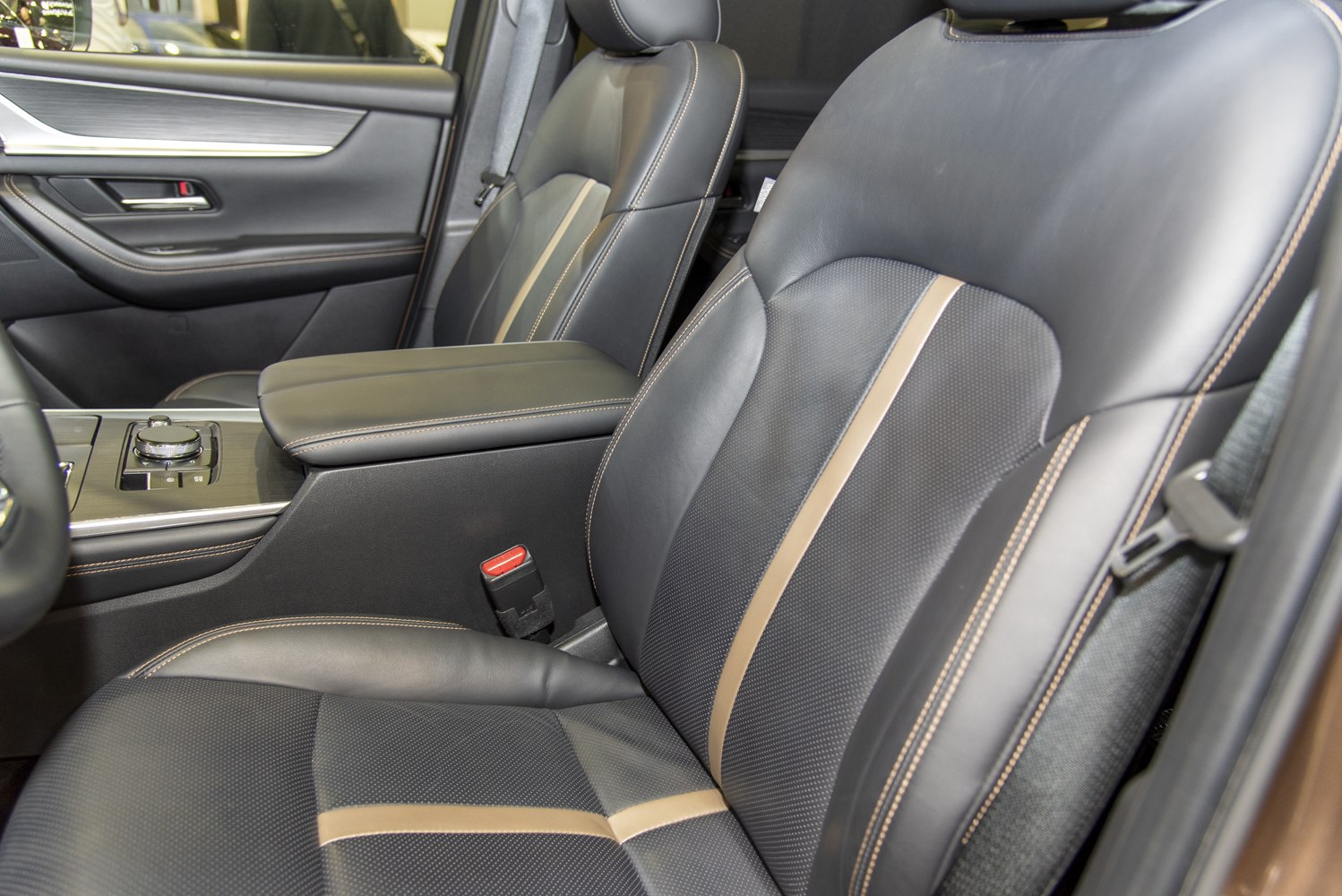 Leather front seats with beige stripe and detailed stitching