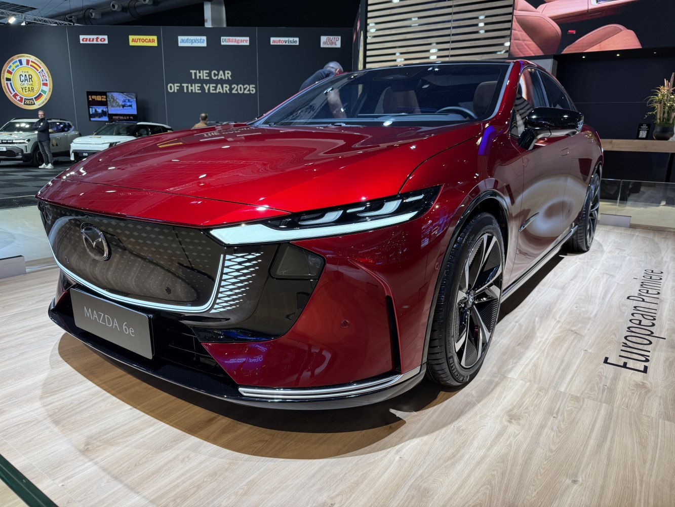 Futuristic front grille and sleek LED headlights on modern sedan