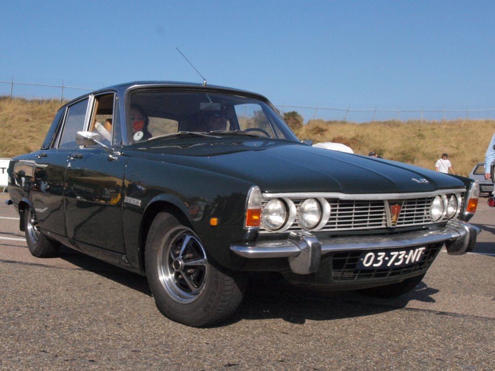 Classic vintage car with quad headlights and chrome grille