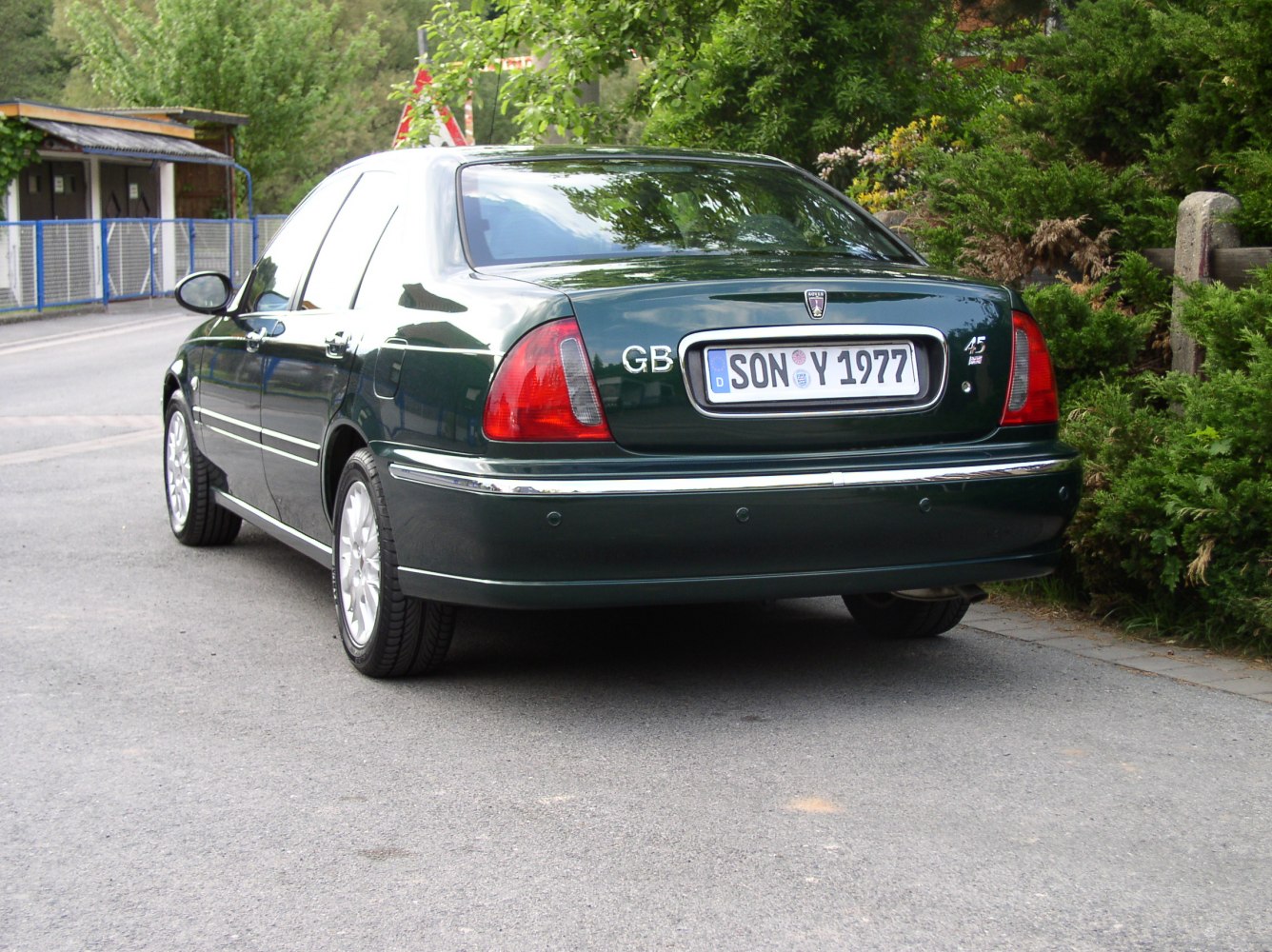 Rear view of classic sedan with distinct tail lights and chrome trim