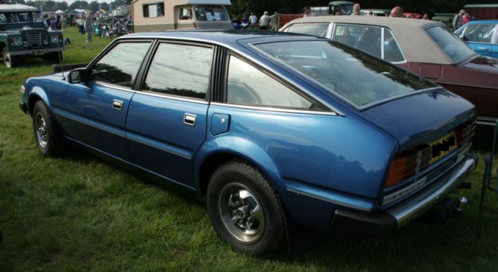 Angular rear hatchback with chrome window trims, metallic blue finish