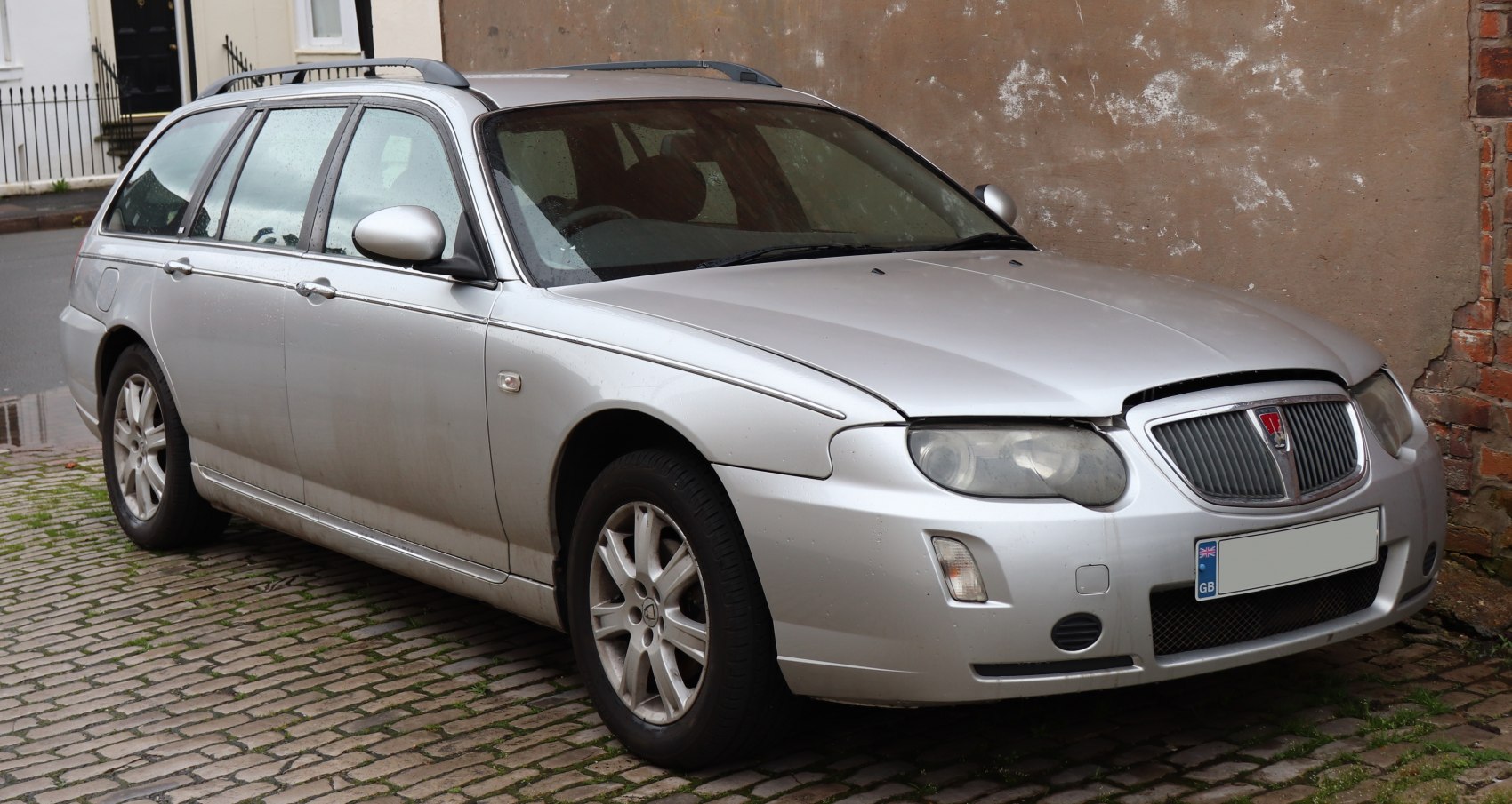 Silver station wagon with roof rails and alloy wheels