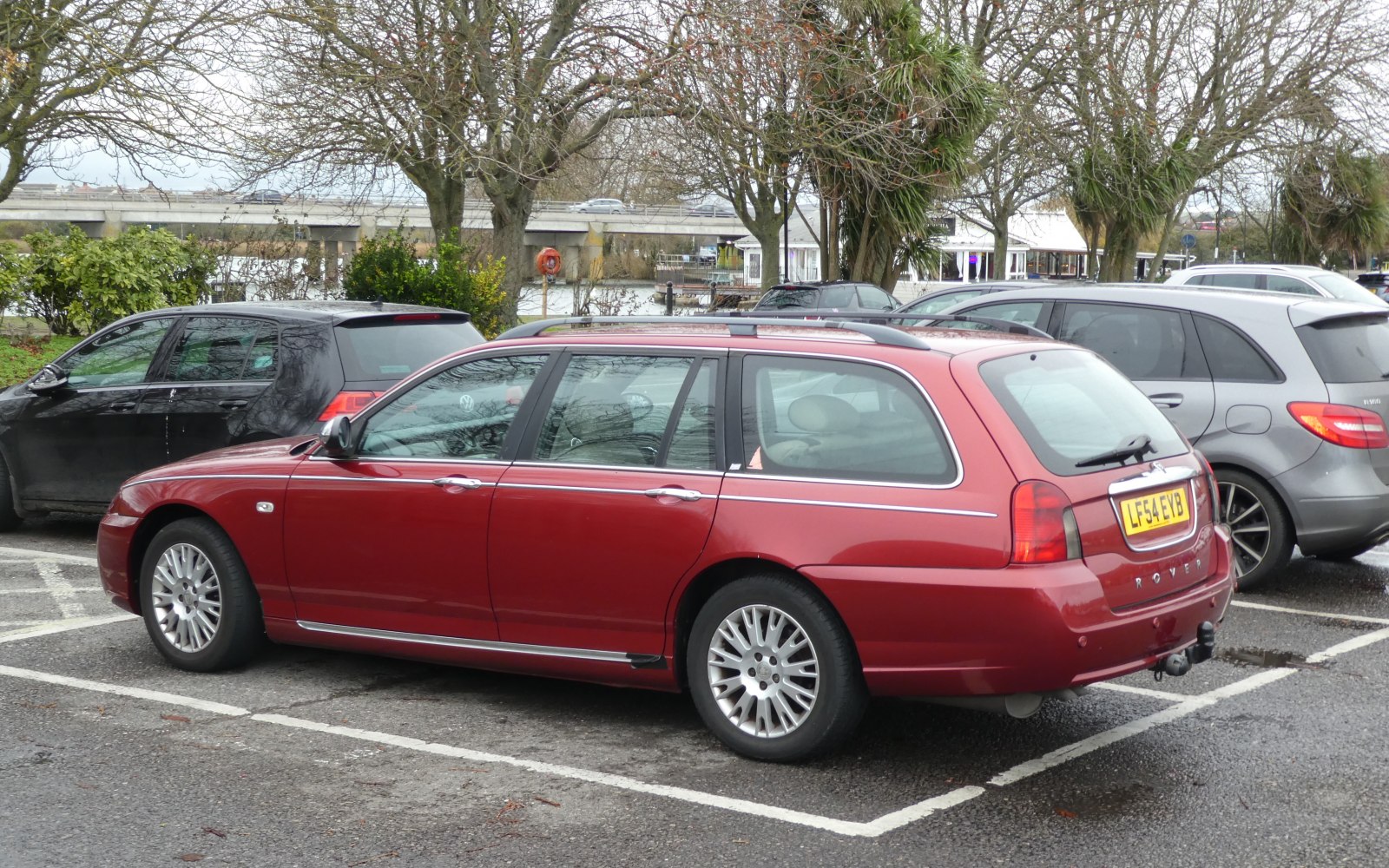 Red estate car rear and side view with multi-spoke alloy wheels.