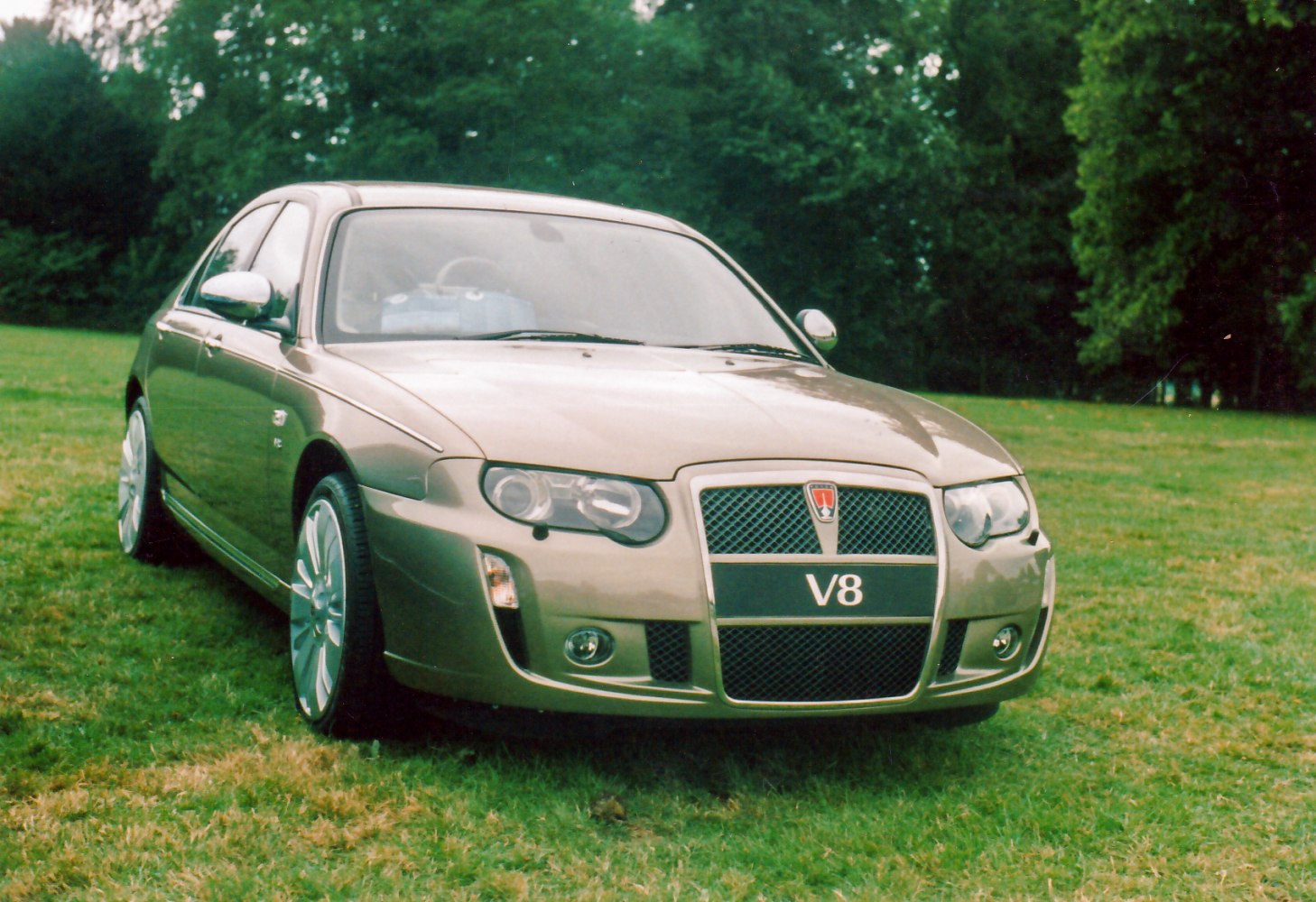 Front view with V8 grille and alloy wheels.