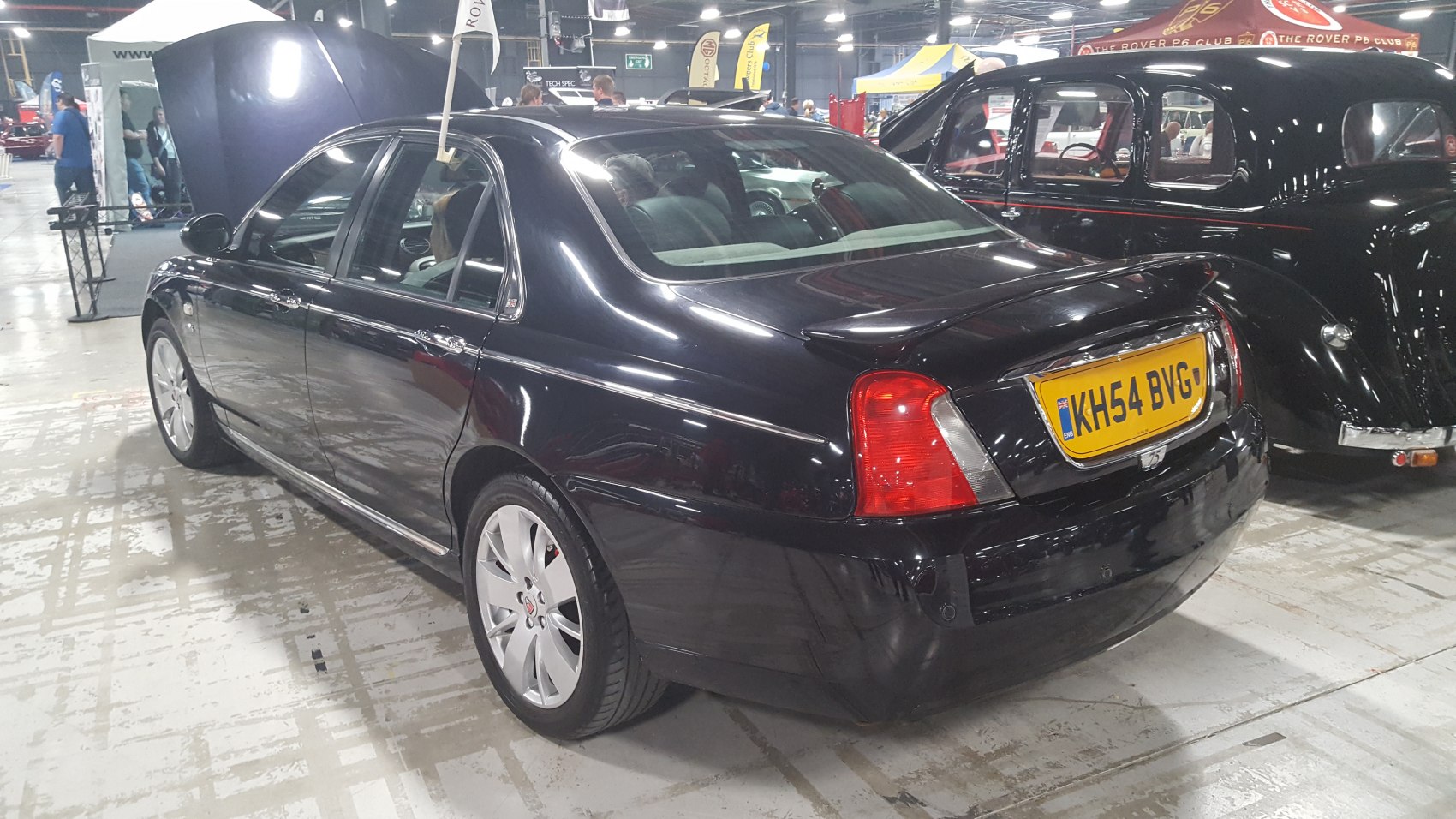 Rear and side view of a 2004 sedan with distinctive taillights and alloy wheels