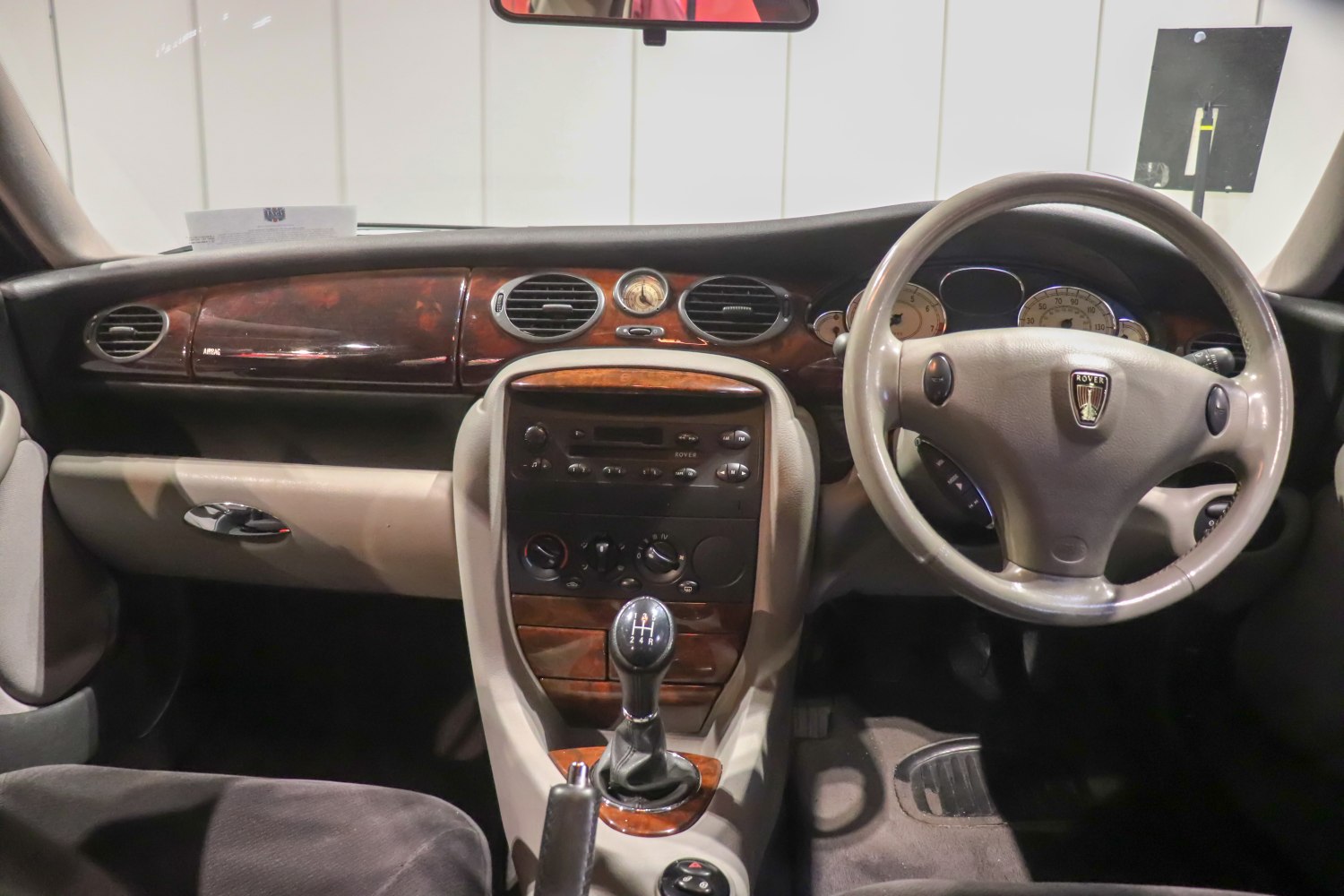Wooden dashboard and manual gear shift with analog clock