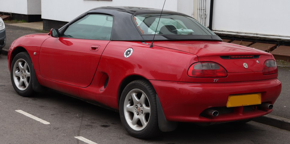 Red convertible with distinct rear lights and hardtop roof