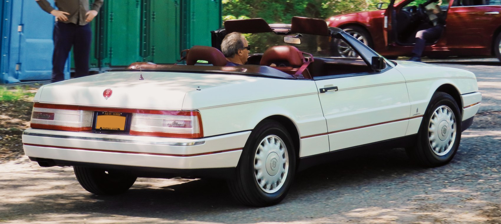 Rear view of a luxury convertible with brown leather seats