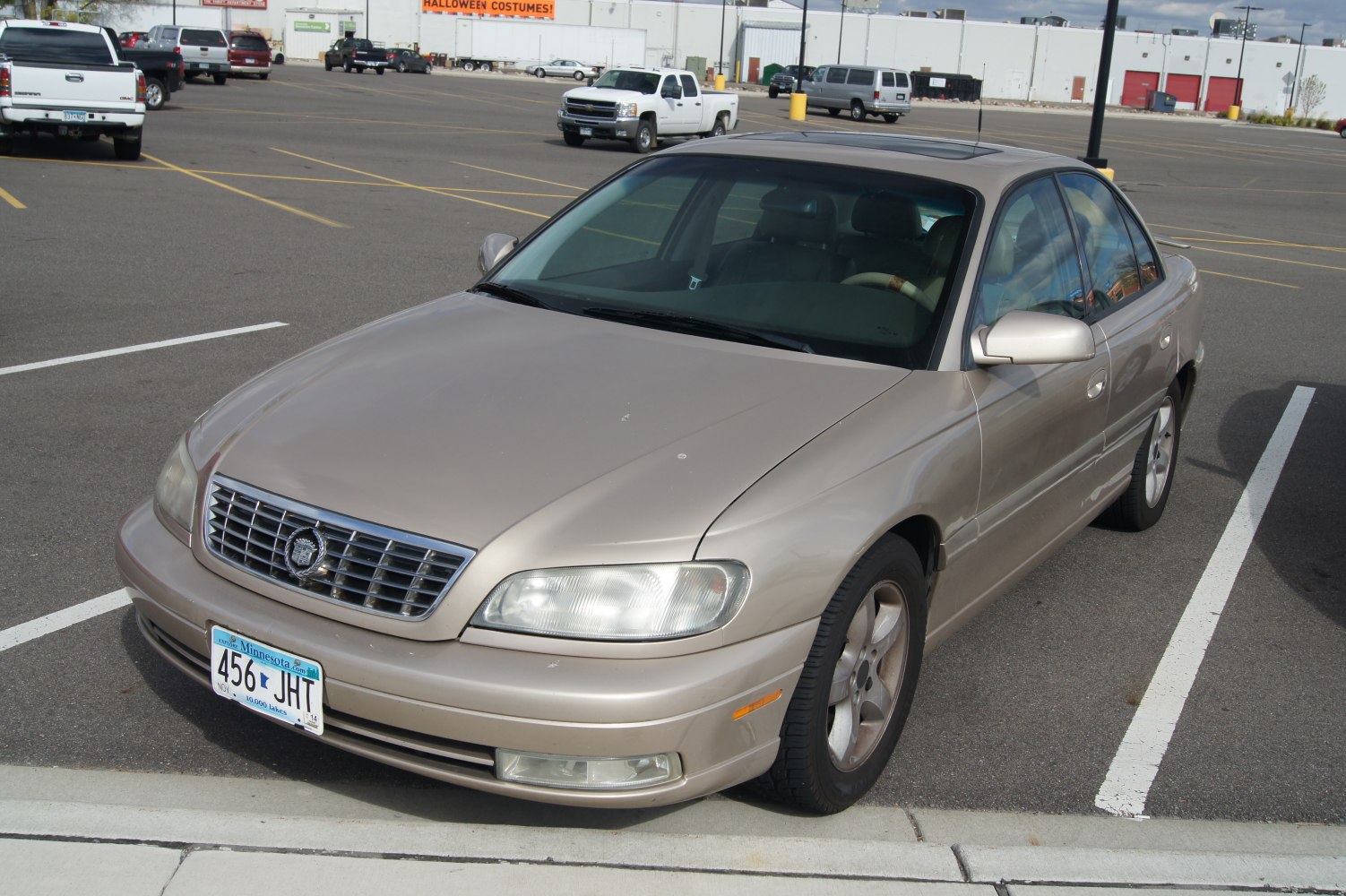 Front three-quarter view of classic sedan with signature grille and alloy wheels