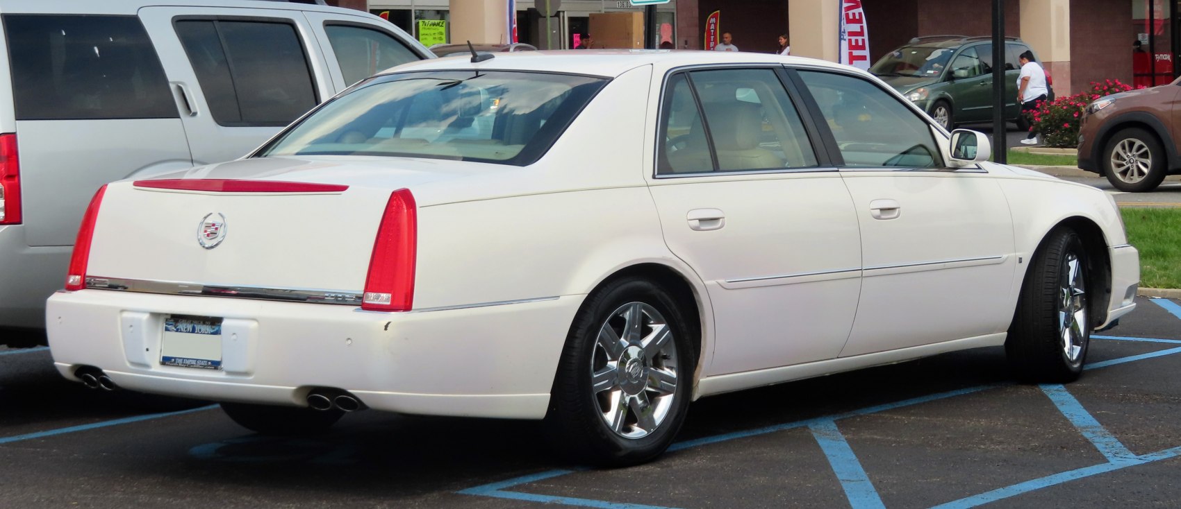 Rear side view with chrome wheels and dual exhaust