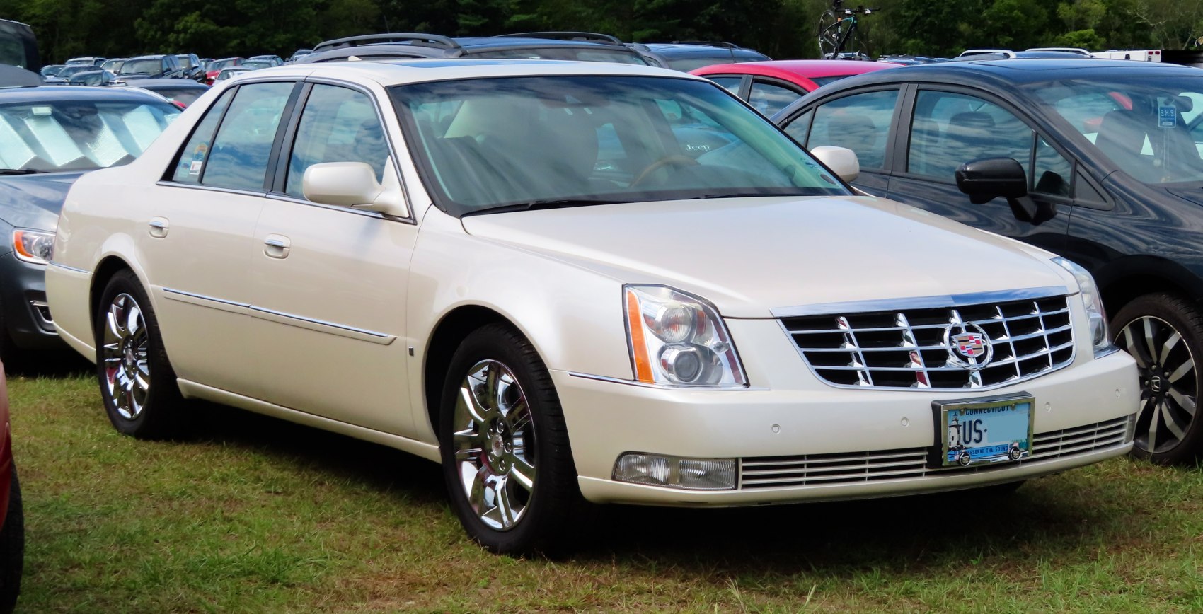 Luxury sedan front and side view with chrome wheels and distinctive grille