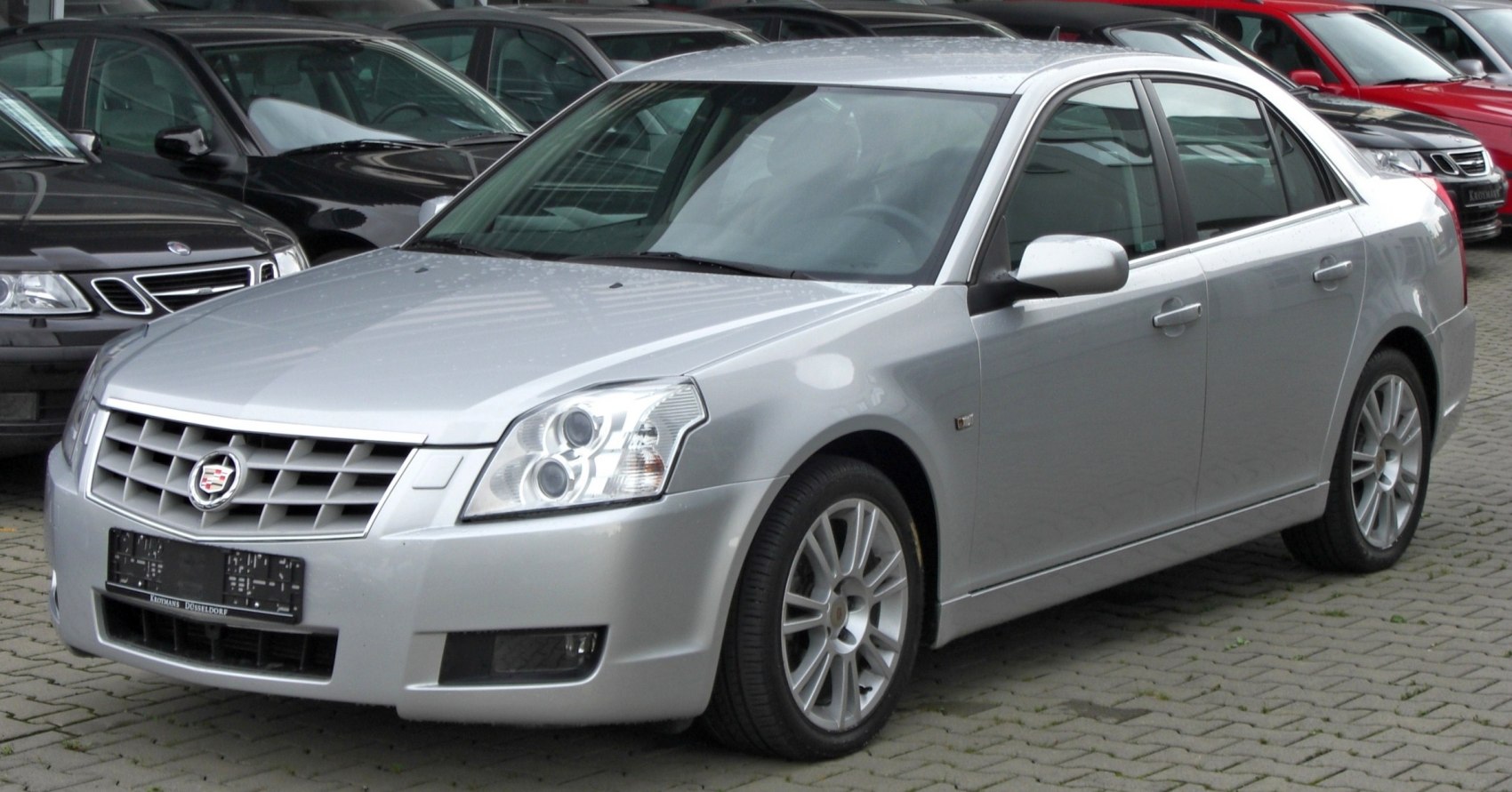 Silver luxury sedan with distinctive grille and alloy wheels