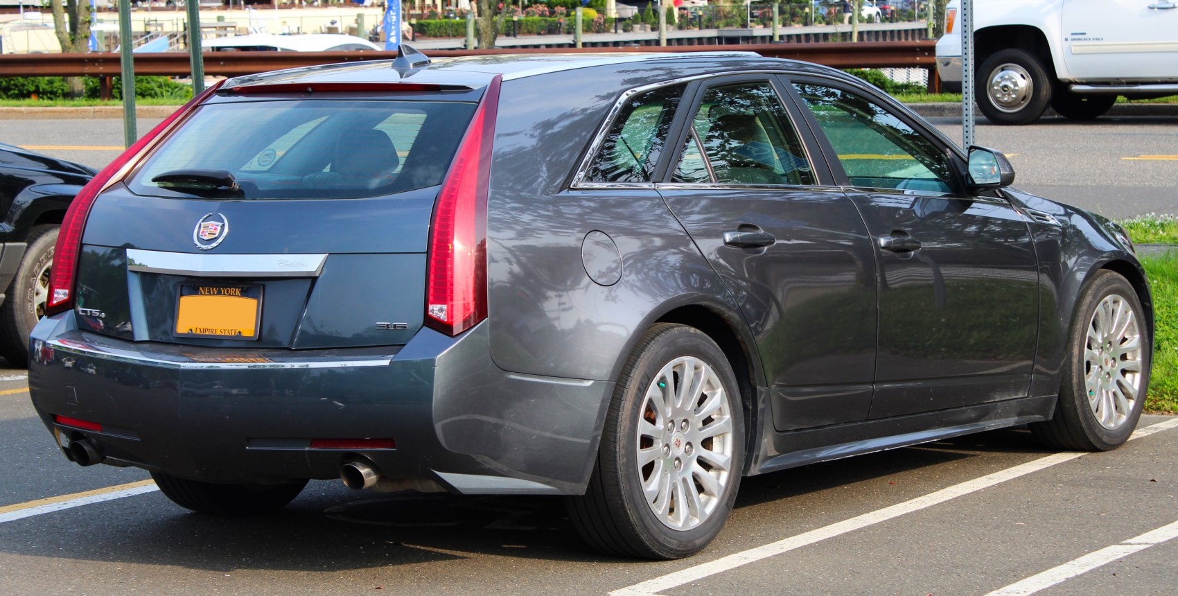 Rear and side view of sport wagon with vertical tail lights and dual exhaust