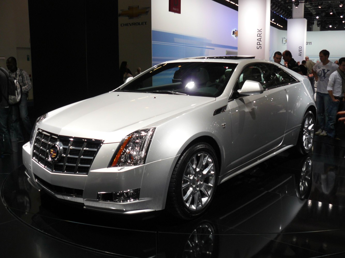 Silver luxury coupe with prominent grille and alloy wheels
