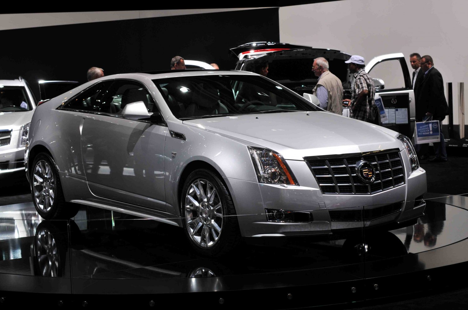 Silver coupe with distinct grille and sharp headlights