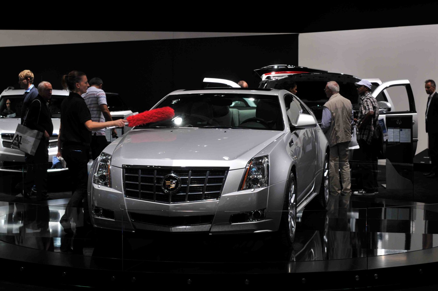 Front view of coupe with chrome grille and angular headlights