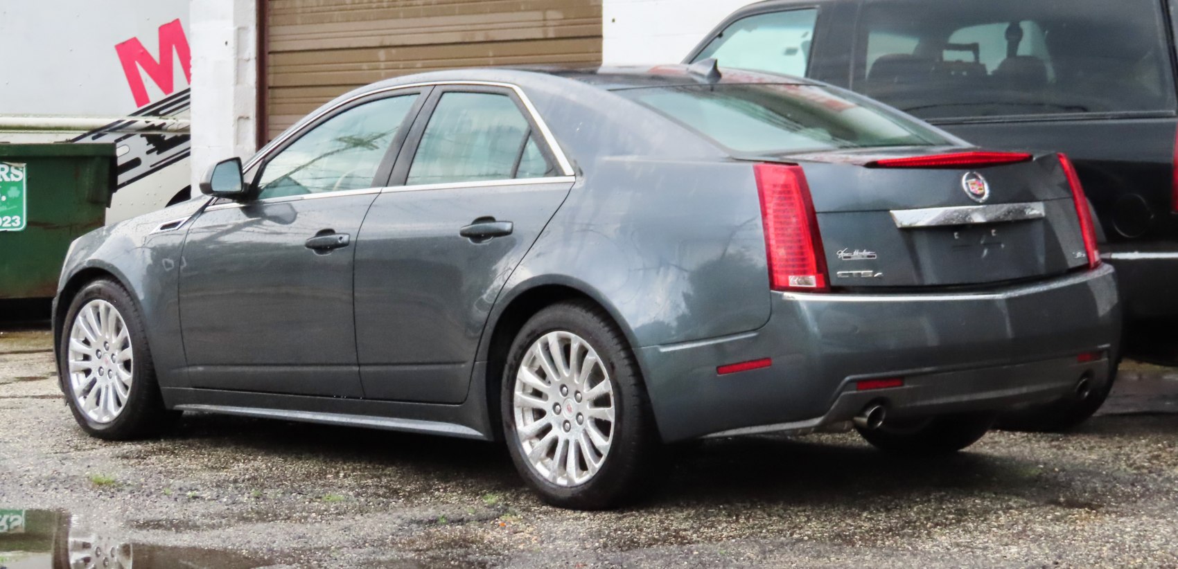 Rear side view with vertical tail lights and alloy wheels