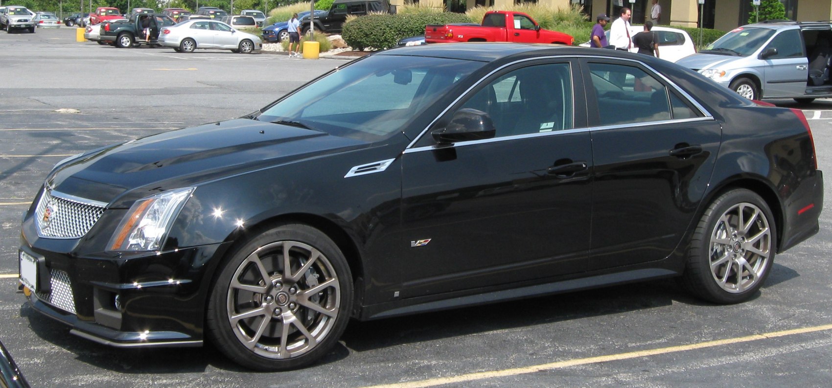 Black luxury sedan with alloy wheels and sporty design