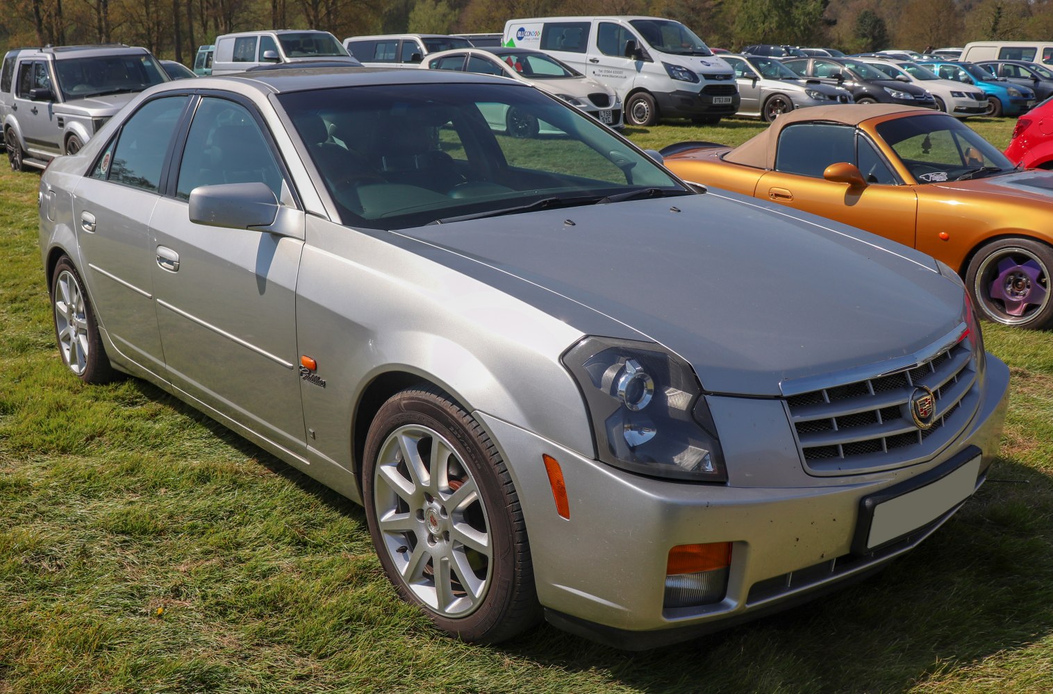 Silver sedan with distinctive grille and multi-element headlights.