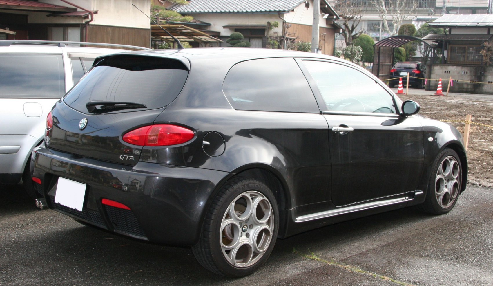 Rear side with distinct alloy wheels and taillights