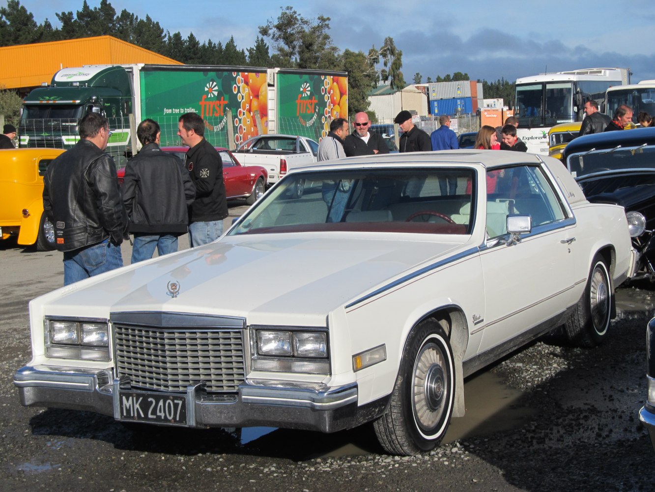 White two-door luxury coupe with distinct front grille