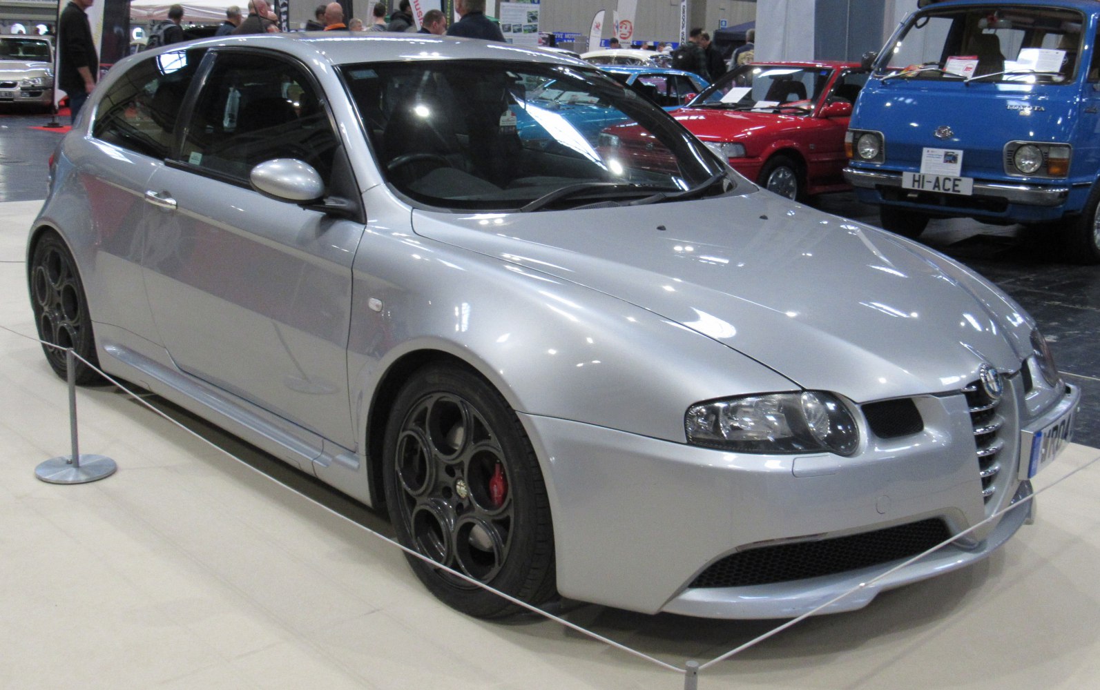 Silver sporty hatchback with front view and black alloy wheels