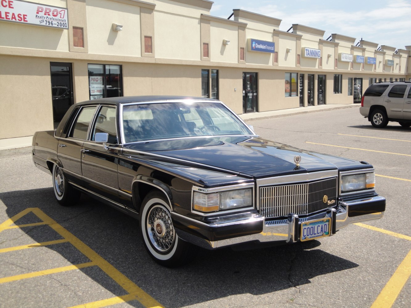 Prominent chrome grille and elegant wire spoke wheels on vintage luxury sedan