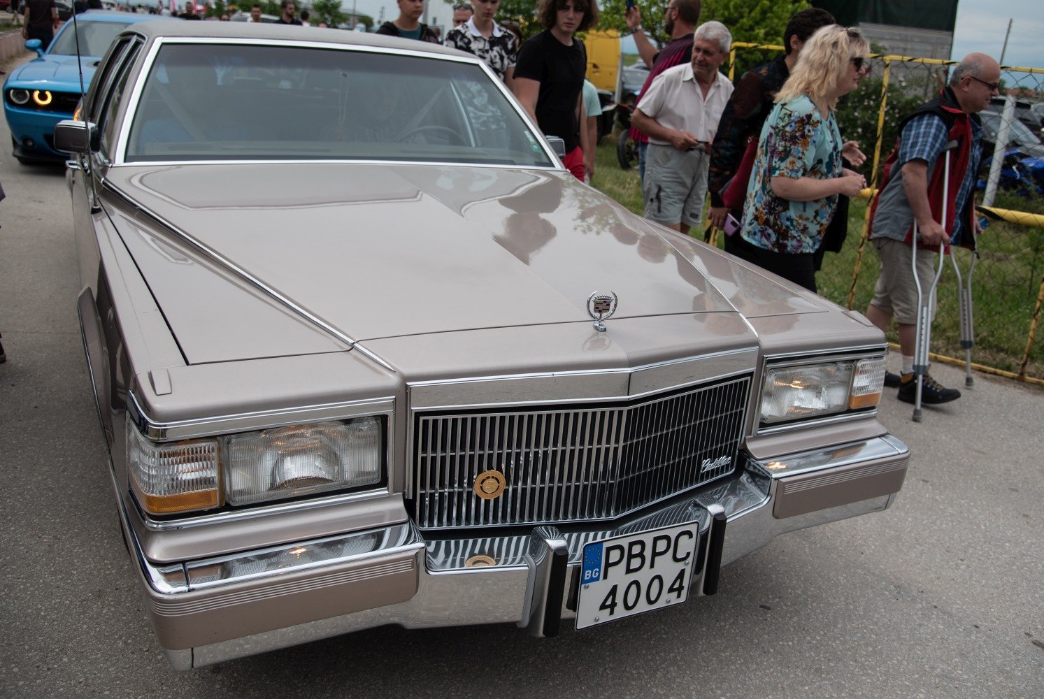 Close-up of vintage front grille and rectangular headlights with chrome details