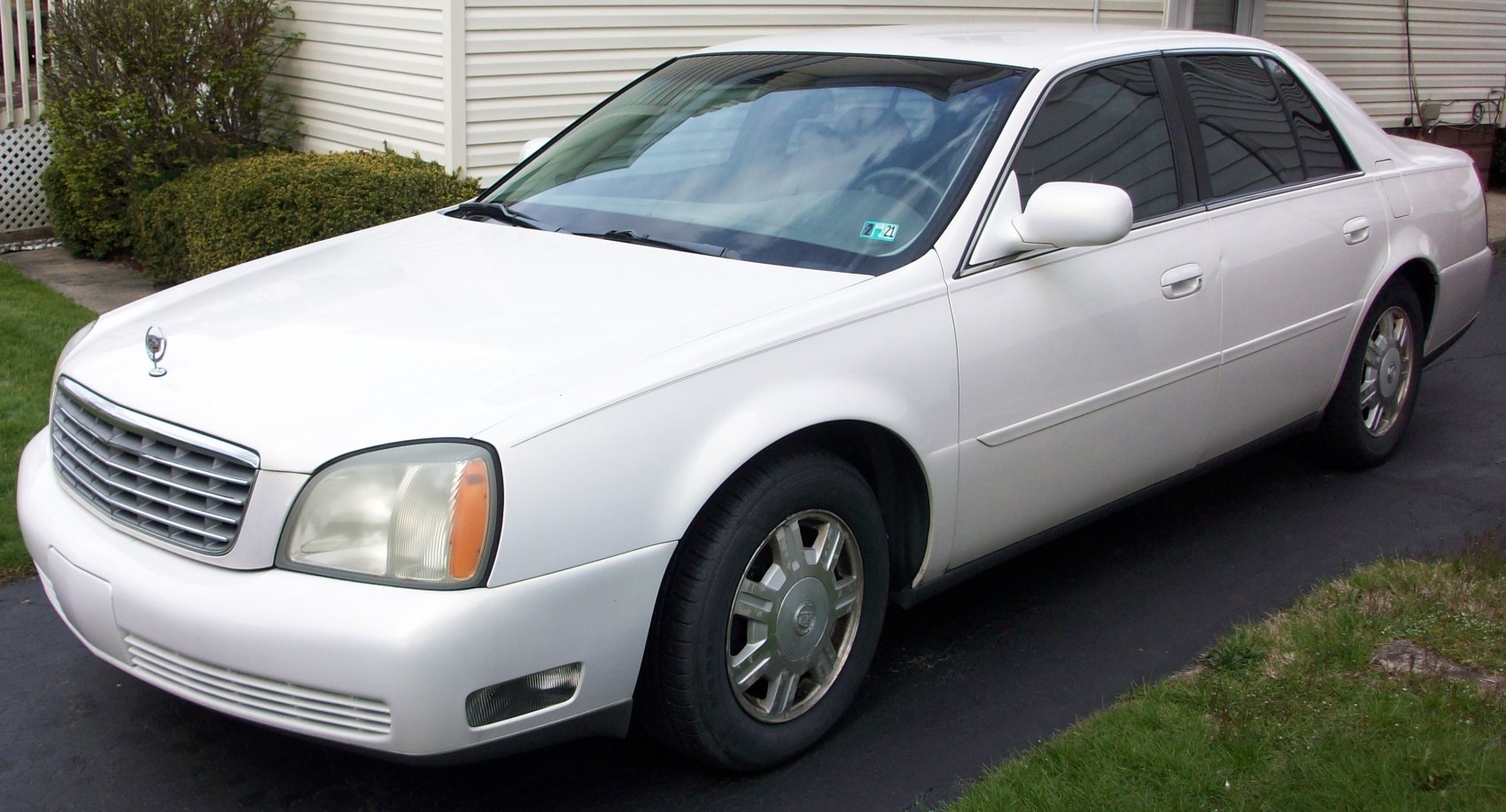 Front-side view of luxury sedan with chrome grille and alloy wheels