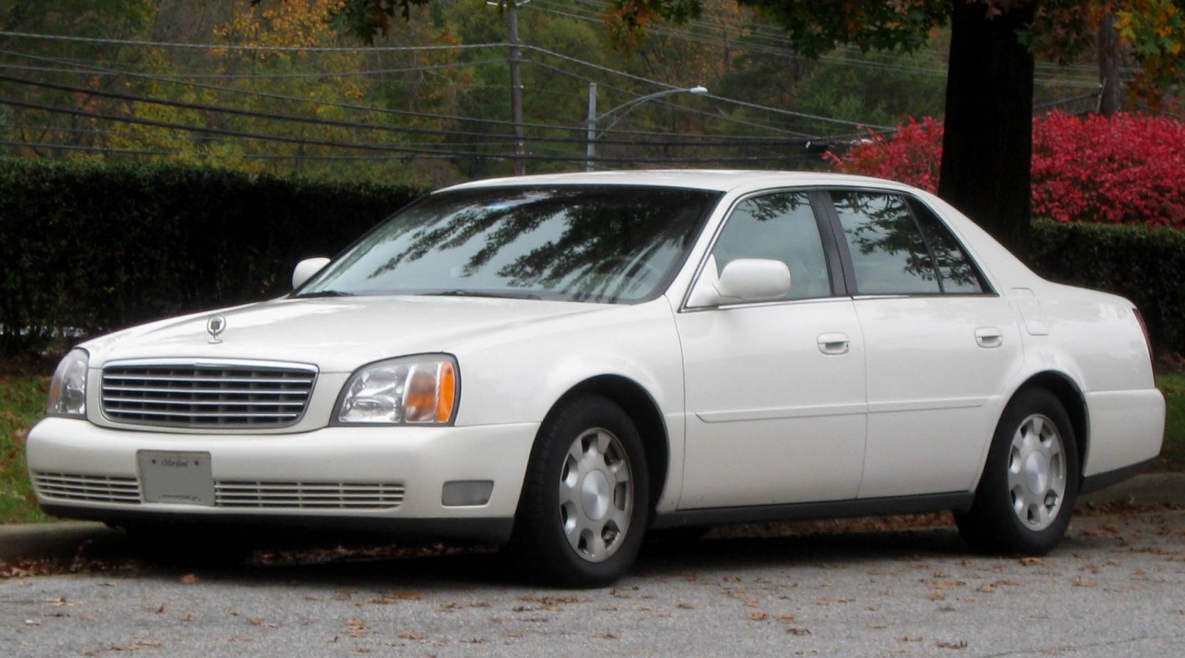 White four-door luxury sedan with classic front grille