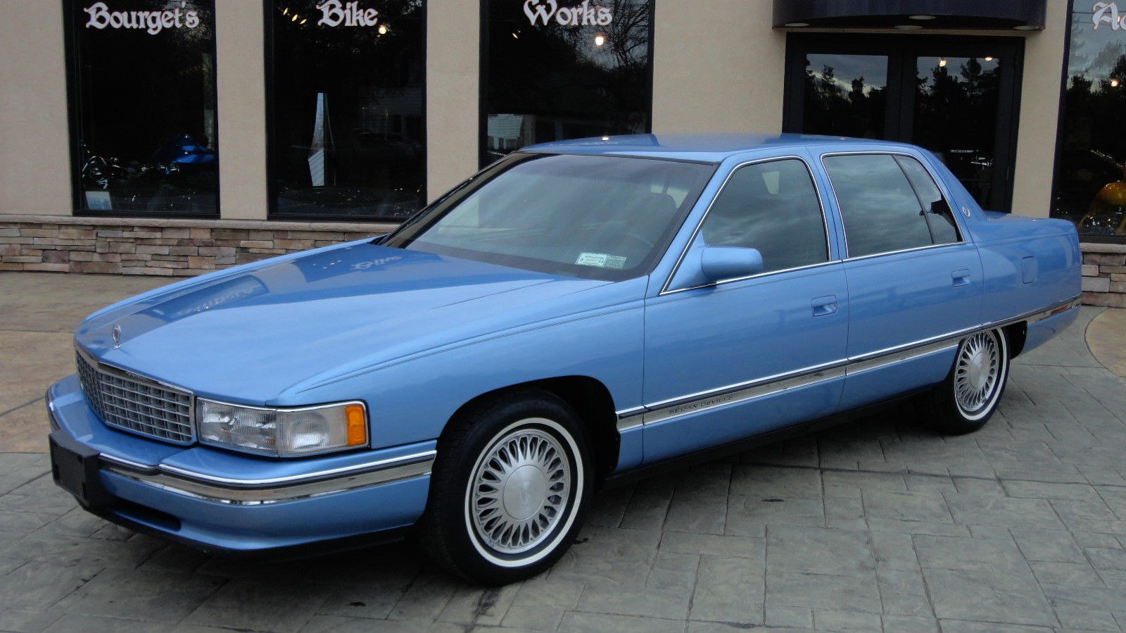 Classic sedan with chrome grille and spoke wheel covers
