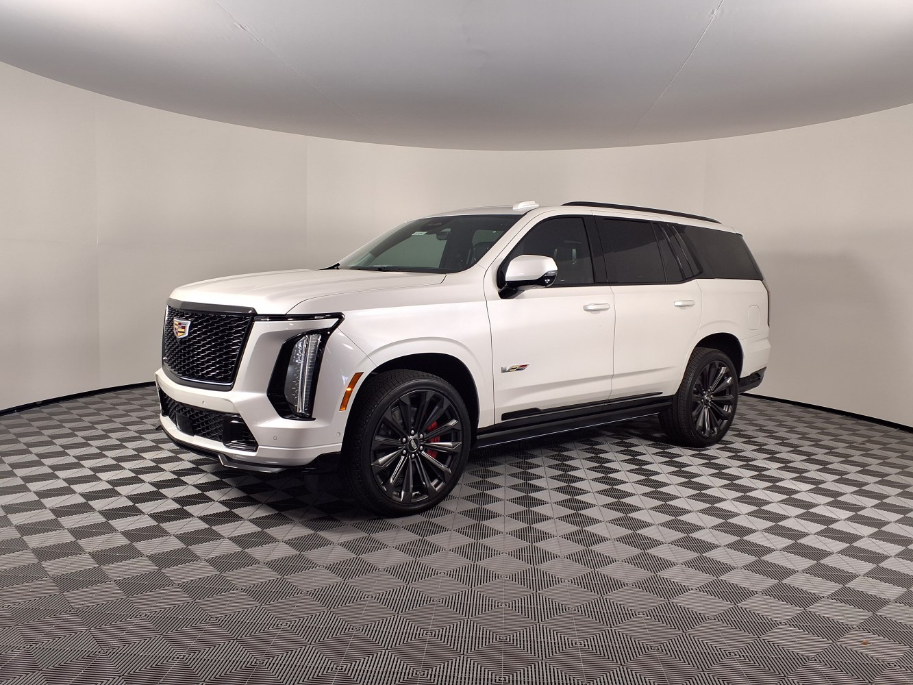 White full-size SUV with black mesh grille and vertical LED headlights