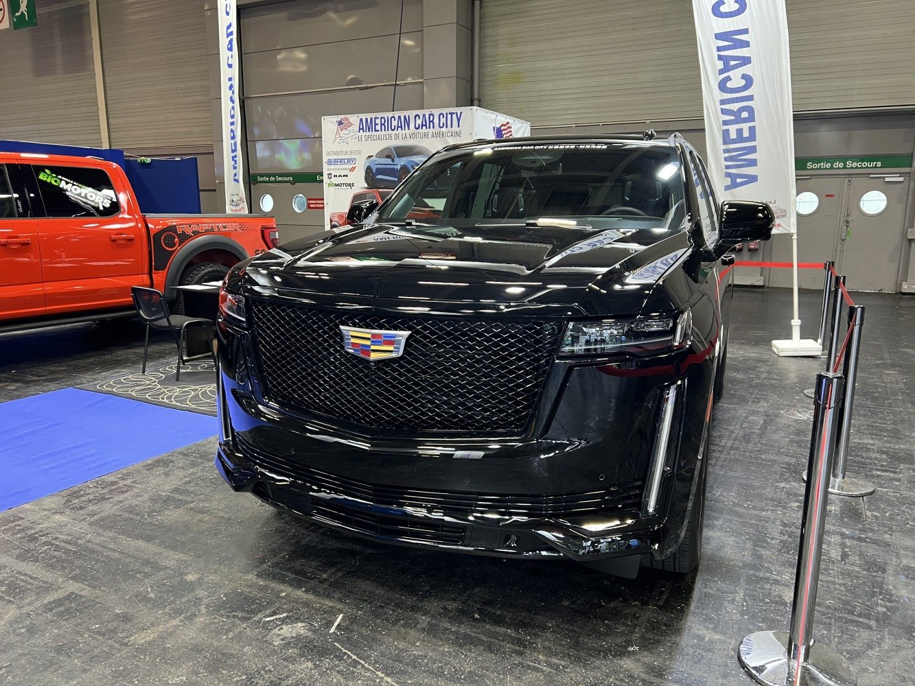 Black SUV front grille with Cadillac emblem and LED headlights
