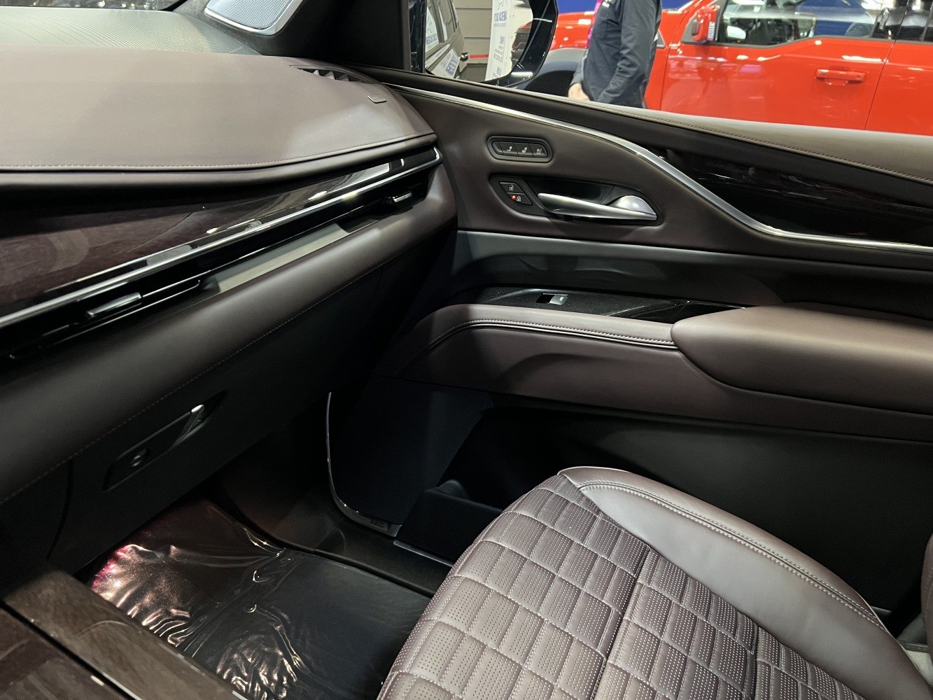 Passenger side interior with quilted leather seat and sleek door panel