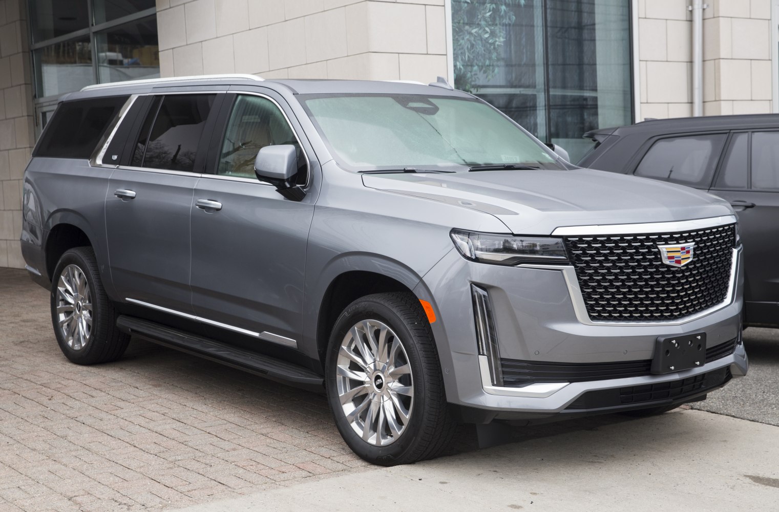 Luxury full-size SUV with mesh front grille and chrome wheels