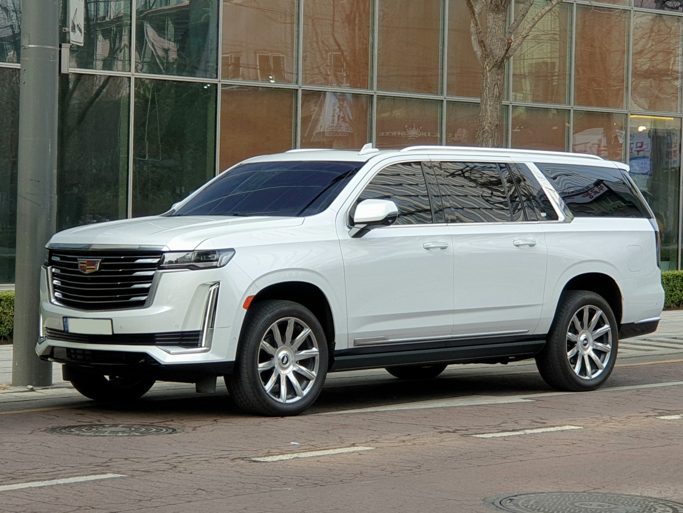 Large luxury SUV with extended body and vertical LED headlights