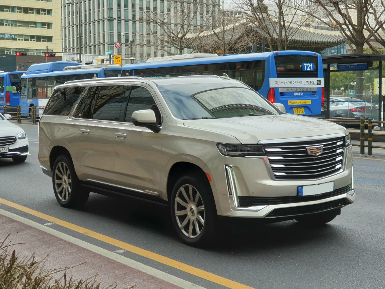 Luxury SUV with large chrome grille and vertical LED headlights