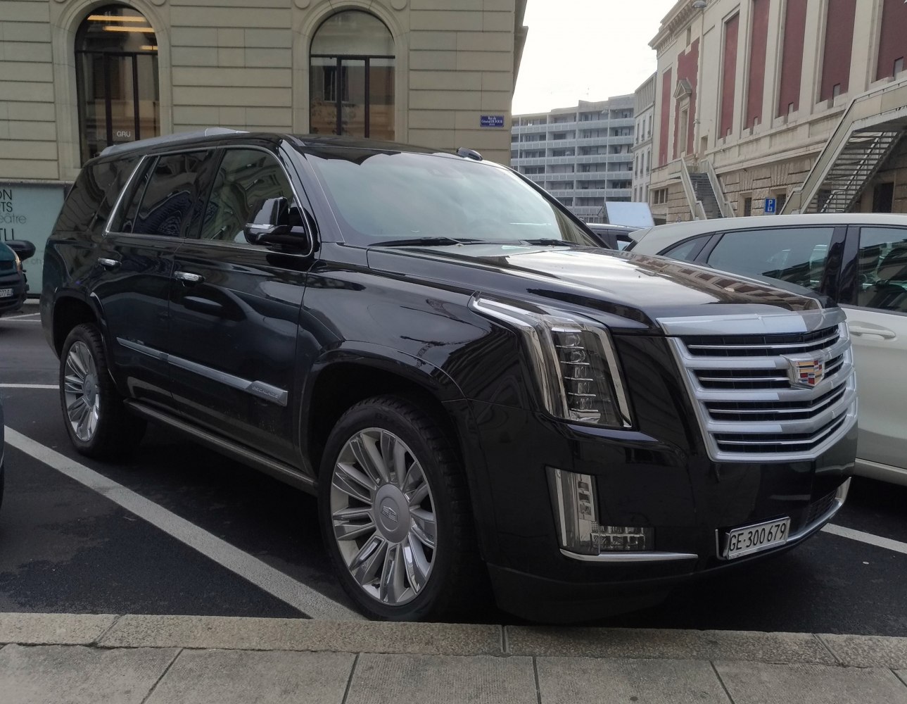 Black luxury SUV with vertical LED headlights and prominent chrome grille