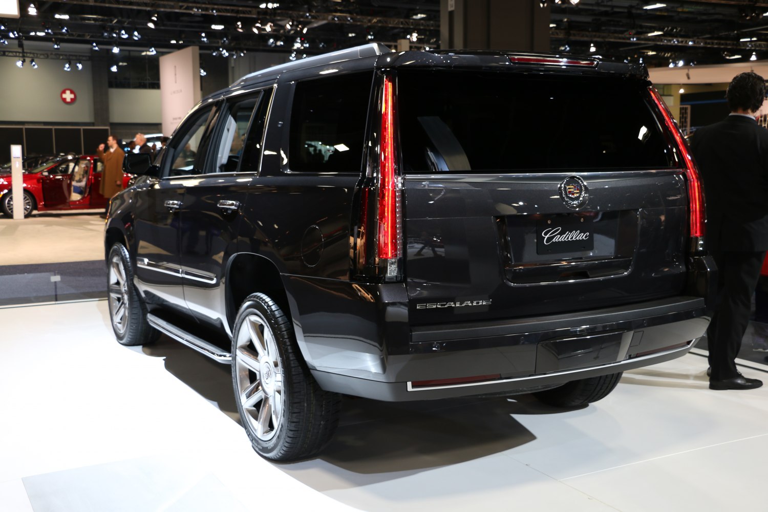 Rear view of a large SUV with tall vertical LED tail lights and big alloy wheels