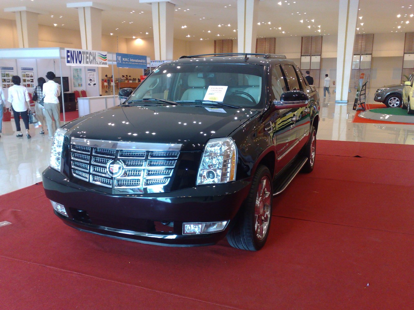Front view with chrome grille and distinctive headlights on a luxury pickup