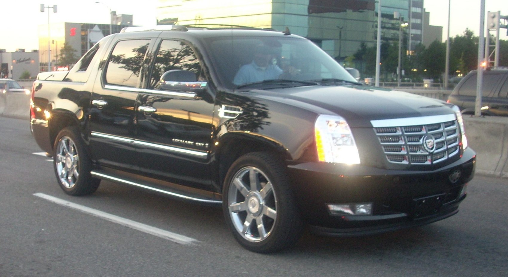 Black extended pickup with chrome wheels and LED headlights