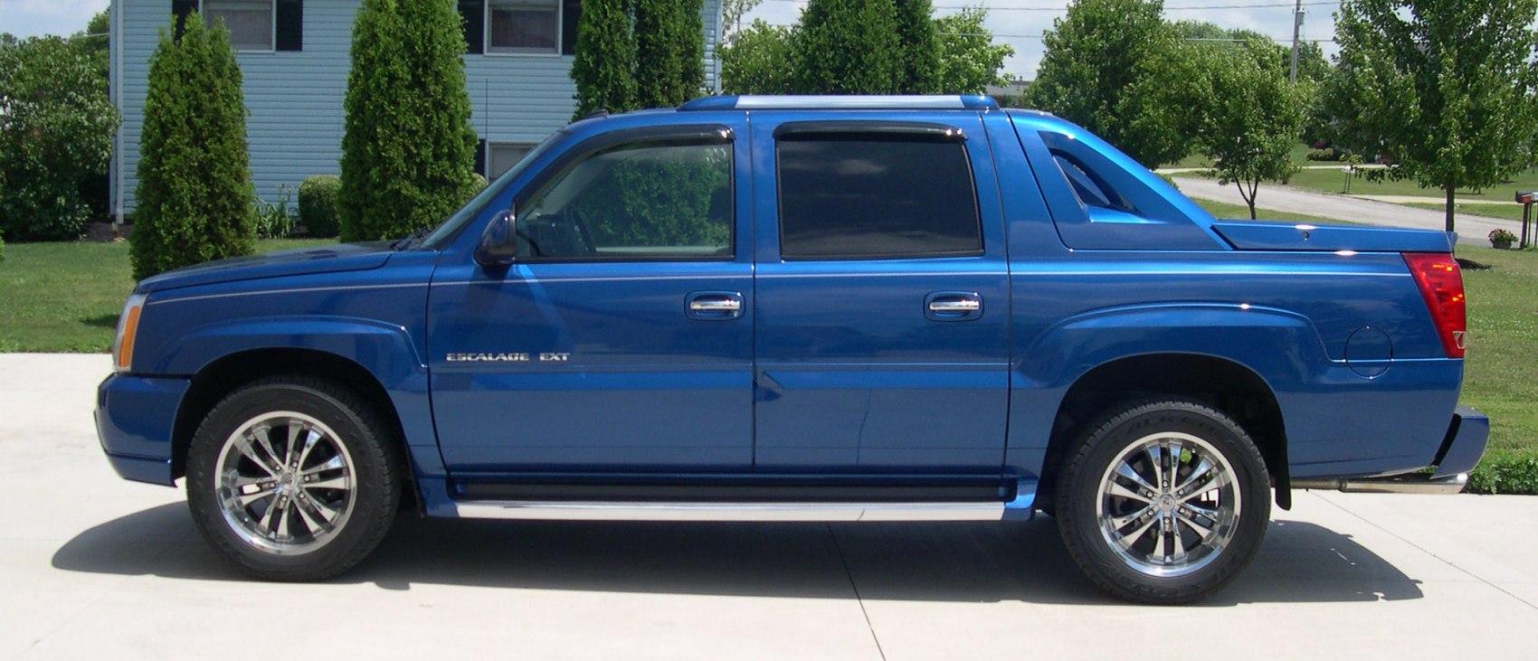 Blue extended dual cab pickup with alloy wheels and sharp angular lines