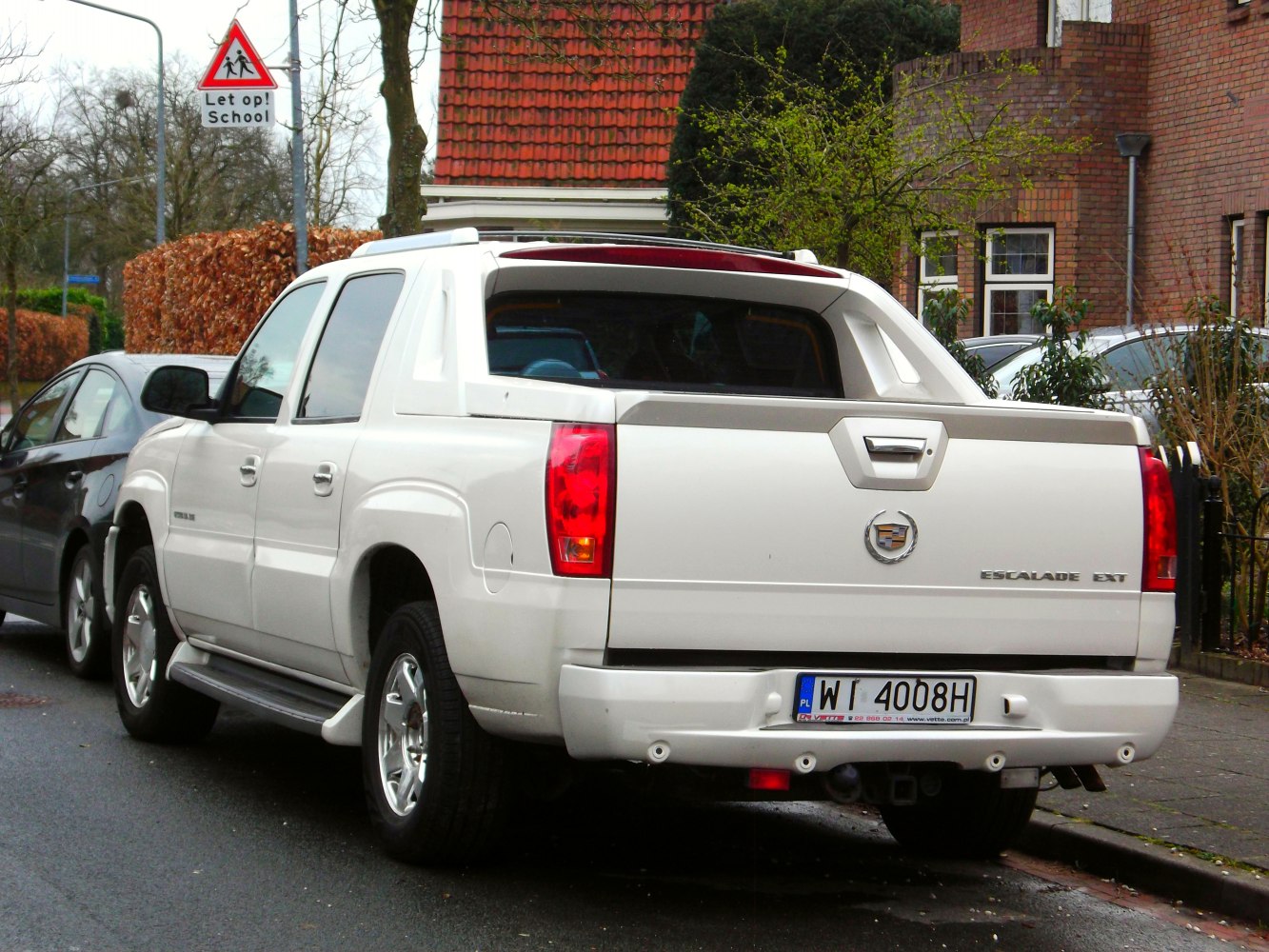 Rear view of luxury pickup truck with distinctive tailgate and taillights