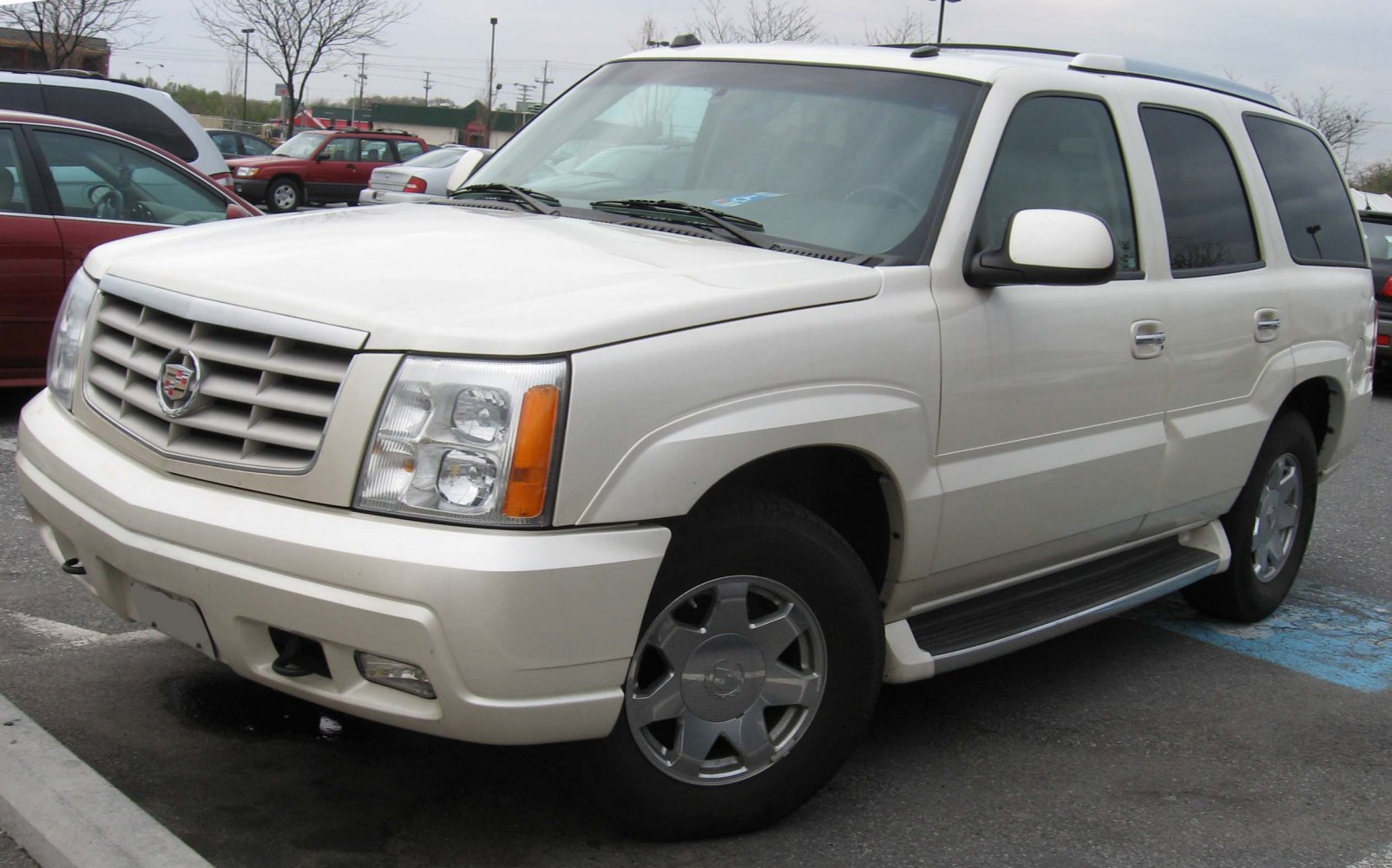 White full-size luxury SUV front grille and side view